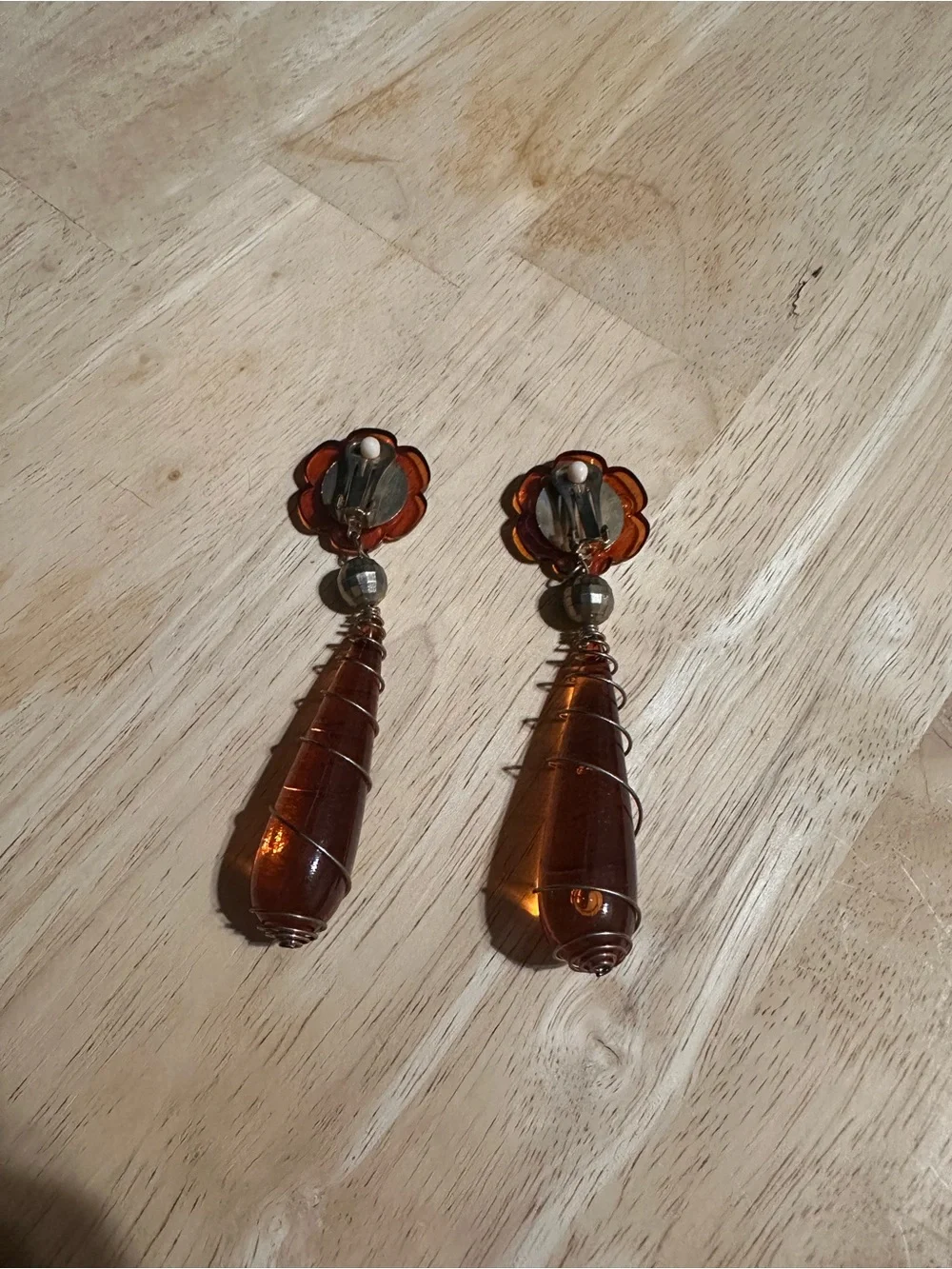 1990s amber Lucite flower and wire-wrapped teardrop dangle clip-on earrings